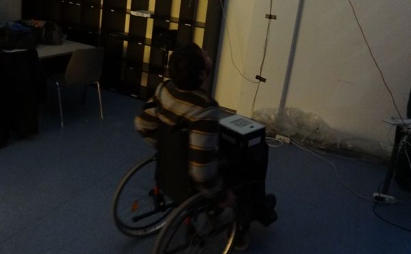 A player on the wheelchair with the infrared tracking device on his lap A player on the wheelchair with the infrared tracking device on his lap